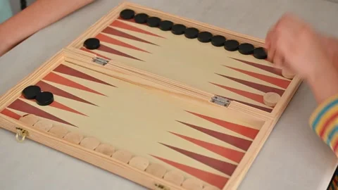 People playing a game of backgammon at home with wooden board 스톡 동영상 290049994