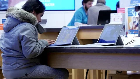 People playing new computer at Microsoft store in Burnaby BC Canada Stock Footage 74405573