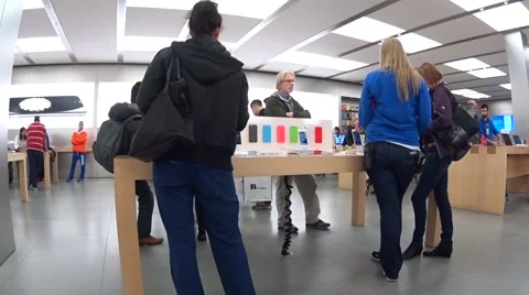People playing new iphone inside apple store Stock Footage 43247724