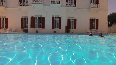 People playing in the pool Stock Footage 114699928