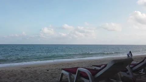 People playing on a quiet beach 스톡 동영상 220317855