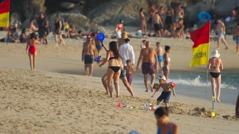 People playing rackets on the beach Stock Footage 277541049