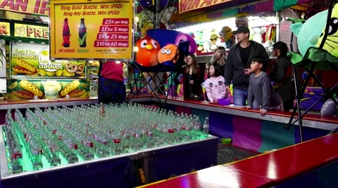 People playing ring gold bottle carnival game in Coquitlam BC Canada. Stock-Footage 63081609