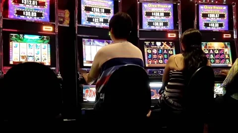 People playing slot machine Video stock 49548320