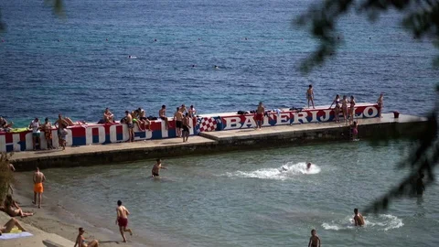 People playing at Split Beach Dock Video stock 111774160