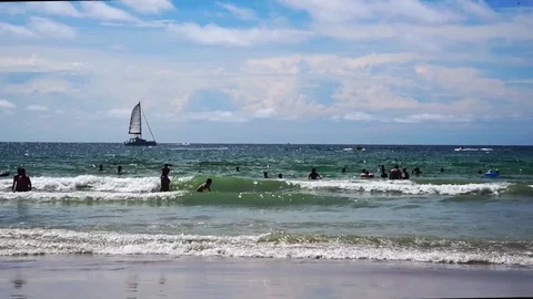 People Playing in the Surf at Kata Beach, Phuket Stock Footage 85134425