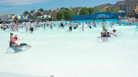 People playing in wave pool Stock Footage 64531756