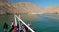 People on a pleasure boat near the coast of Musandam peninsula in Oman HD Footage