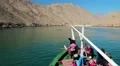 People on a pleasure boat near the coast of Musandam peninsula in Oman HD Footage