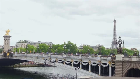 People on Pont Alexandre III with Eiffel Tower in Paris, France 06.07.2025 Stock Footage 310953672