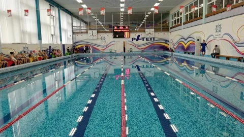 People in the pool walk on the side of the pool Stock Footage 165382226
