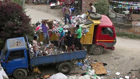 People from poorer areas working in sorting on the dump in Nepal Stock Footage 75575156