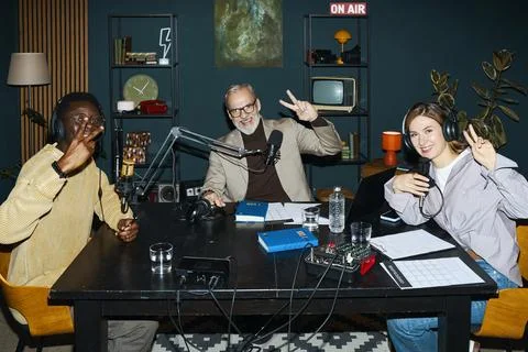People Posing At Camera During Podcast Stock Photos