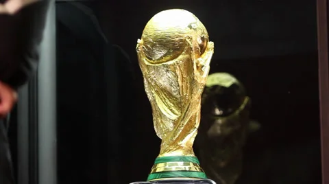 People posing next to the world cup 2014 trophy Stock Footage 35960071