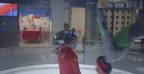 People Practice Flying In Wind Tunnel 2 Stock Footage 76497191