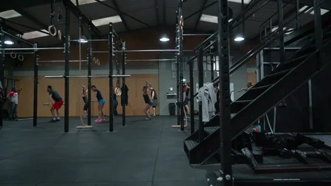 People practicing in crossfit gym Stock Footage 100433199