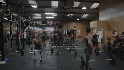 People practicing in crossfit gym Video stock 100435115