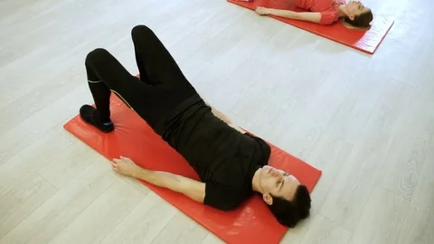 People practicing exercises of gymnastics with trainer in sports hall. HD Stock Footage 73120166