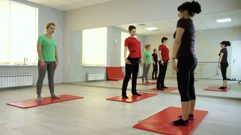People practicing exercises of gymnastics with trainer in sports hall. HD Stock-Footage 73120183