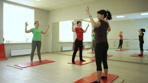 People practicing exercises of gymnastics with trainer in sports hall. HD 库存影片 73133719