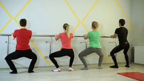 People practicing exercises of gymnastics with trainer in sports hall. HD 库存影片 73133731