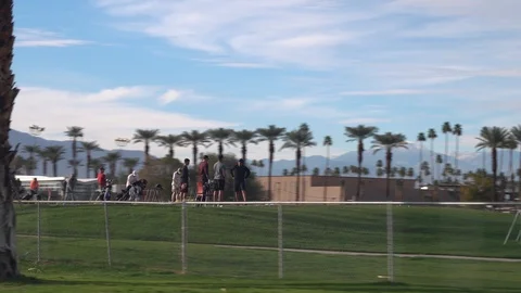 People practicing golf at the golf range in Palm Desert, California Stock Footage 107943571