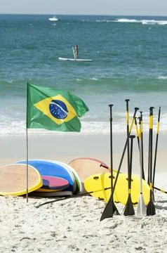 People practicing stand up in the sea Stock Photos