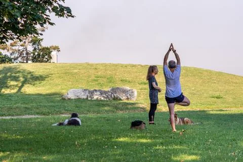 People practicing yoga in Kalemegdan park in Belgrade, Serbia Stock Photos