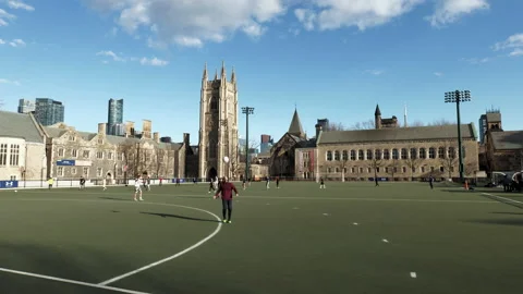People practising soccer in Back Campus, University of Toronto, Hart House, wide Stock Footage 192036431
