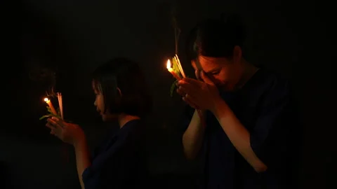 People pray in dark background of religious  Stock Footage 238770099