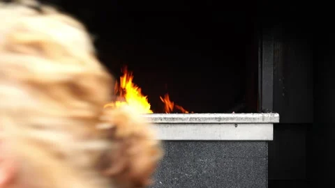 People pray by throwing large candles into the burning fire. Stock Footage 307209890