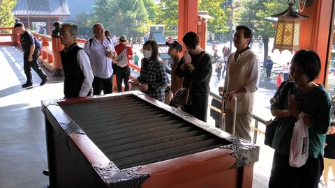 People praying first before getting inside in Tokyo Japan Stock Footage 121436841