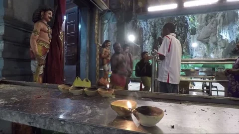 People praying in Hindu Temple inside Main cave, Batu caves, Kuala Lumpur Stock Footage 196397036