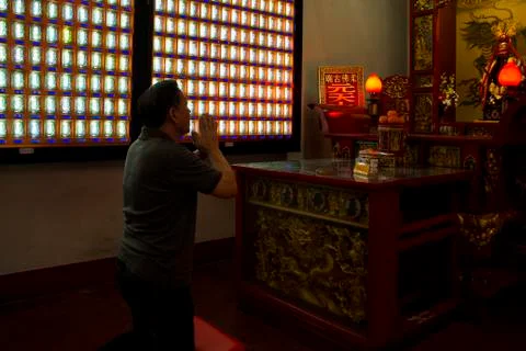 People praying inside the temple during CNY. Stock Photos