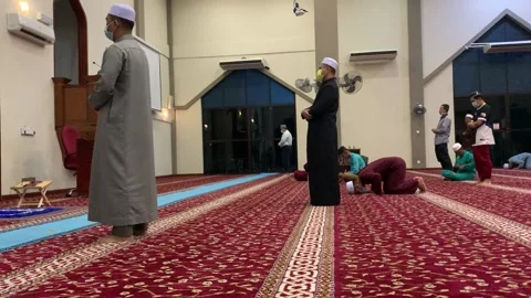 People praying in a mosque Stock Footage 200831123