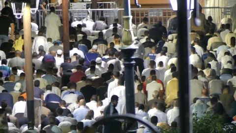 People praying out of Marrakech mosque during ramadam, Africa in 4K Stock Footage 93896072