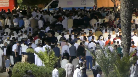 People prepare to pray out of Marrakech mosque during ramadam, Africa in 4K Stock Footage 93895186