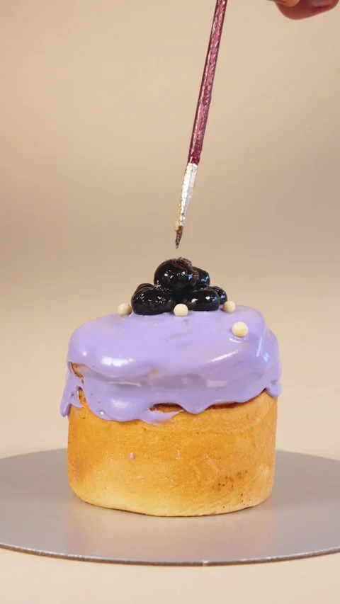 People preparing cinnamon roll with blackberries in final process Stock Footage 236687897