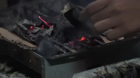 People preparing for the grill. flame on charcoal. hand preparing for grillin Stock Footage 167811862