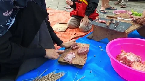 People preparing satay or meat skewers outdoors Stock Footage 279445528