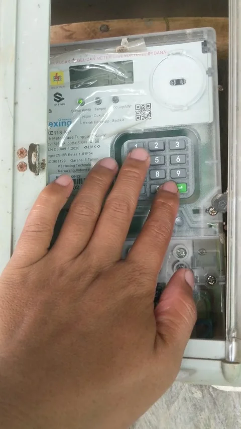 People pressing the electricity kilometer button at home Stock Footage 283912274
