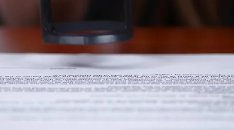 People processes the documents and puts the mark of the seal. Close up Video stock 65728013