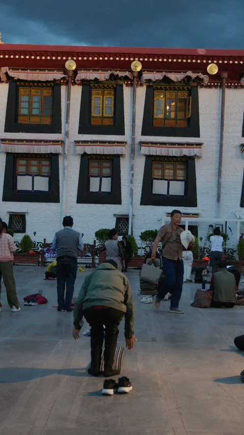 People prostrating in Jokhang Temple in Lhasa Stock Footage 312598142