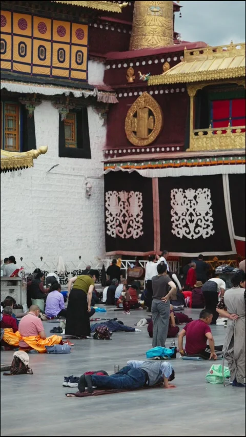 People prostrating in Jokhang Temple in Lhasa Stock Footage 312598683