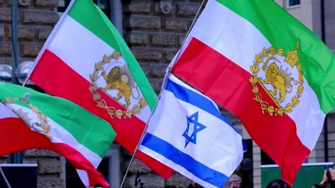 People protest by waving Iranian and Israeli flags together in solidarity Stock Footage 333545371