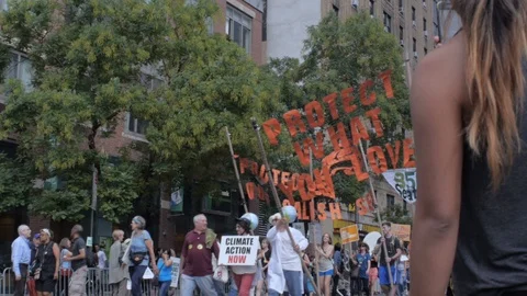 People protesting and marching at a climate change event on West 42nd ave in NYC Stock Footage 87787654