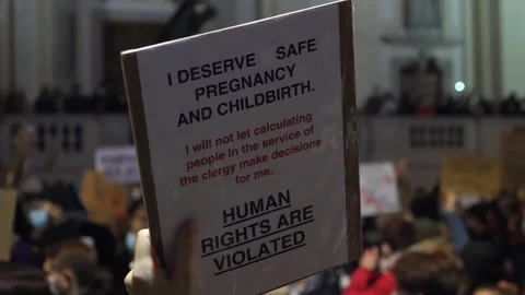 People Protesting Over Abortion Law With Protest Signs. Human Rights Violations Video stock 142193095