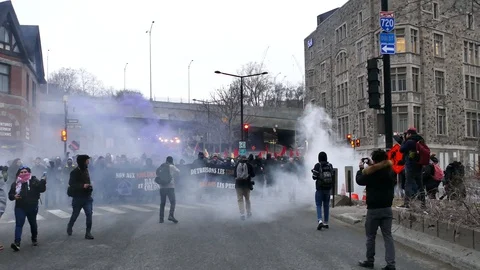 People protesting in the smoke Stock Footage 114764584