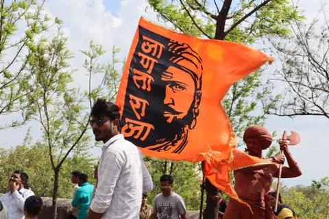 People protesting on the streets with flags and posters. Stock Photos