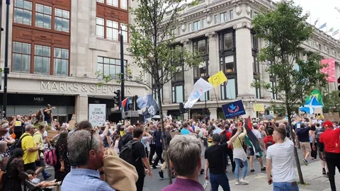 People protesting on the streets of London regarding lockdown measures Stock Footage 156296288